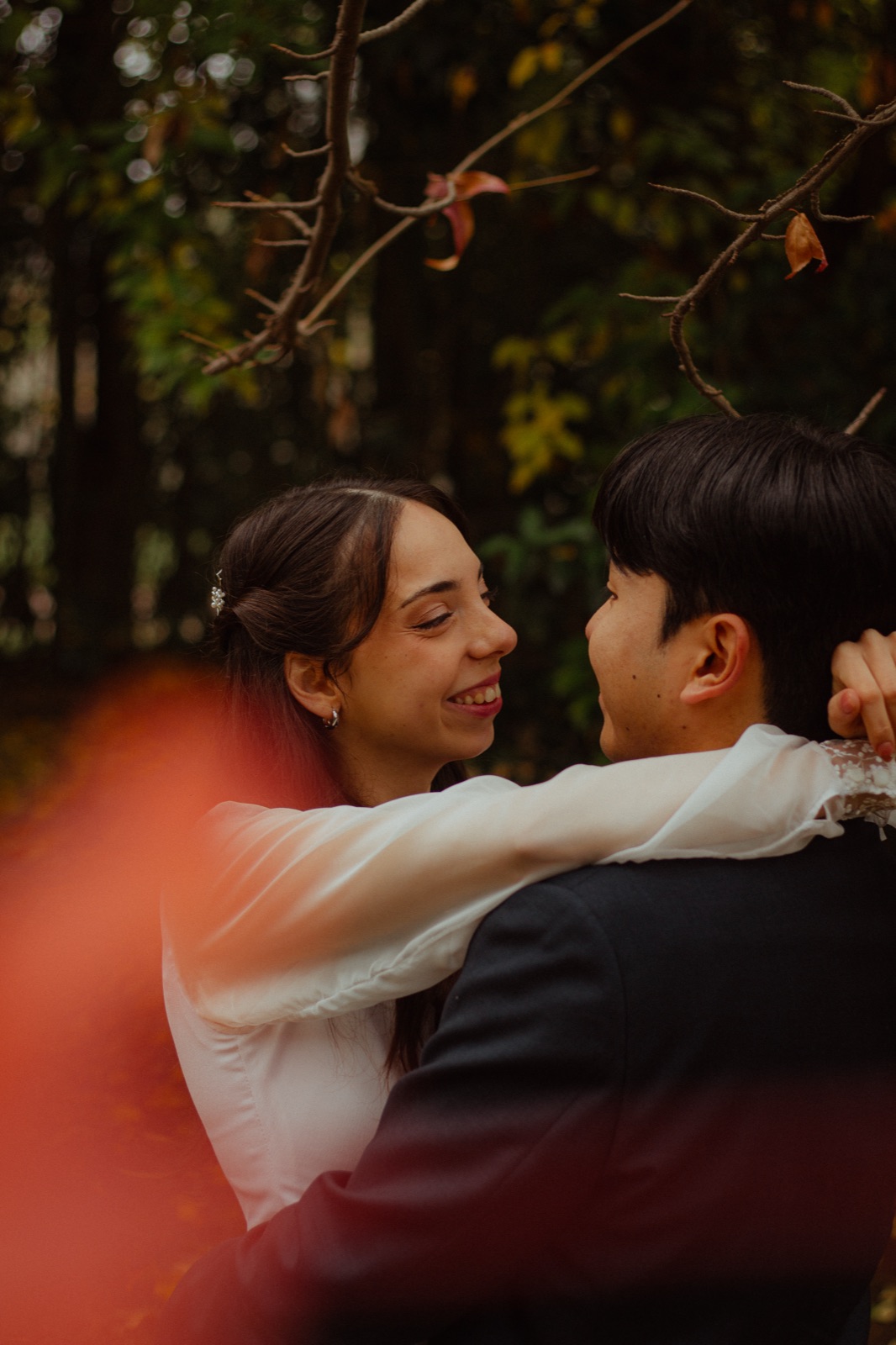 Ludmila hugs Chi Hun mid-spin, the image left in motion