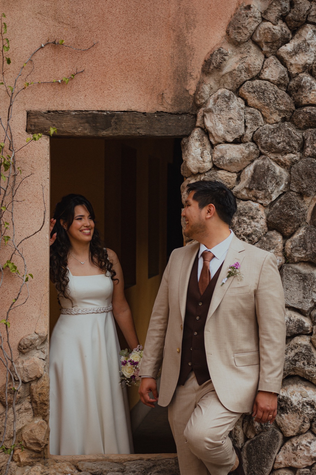 Mariano and Silvi at the door of an old stone house